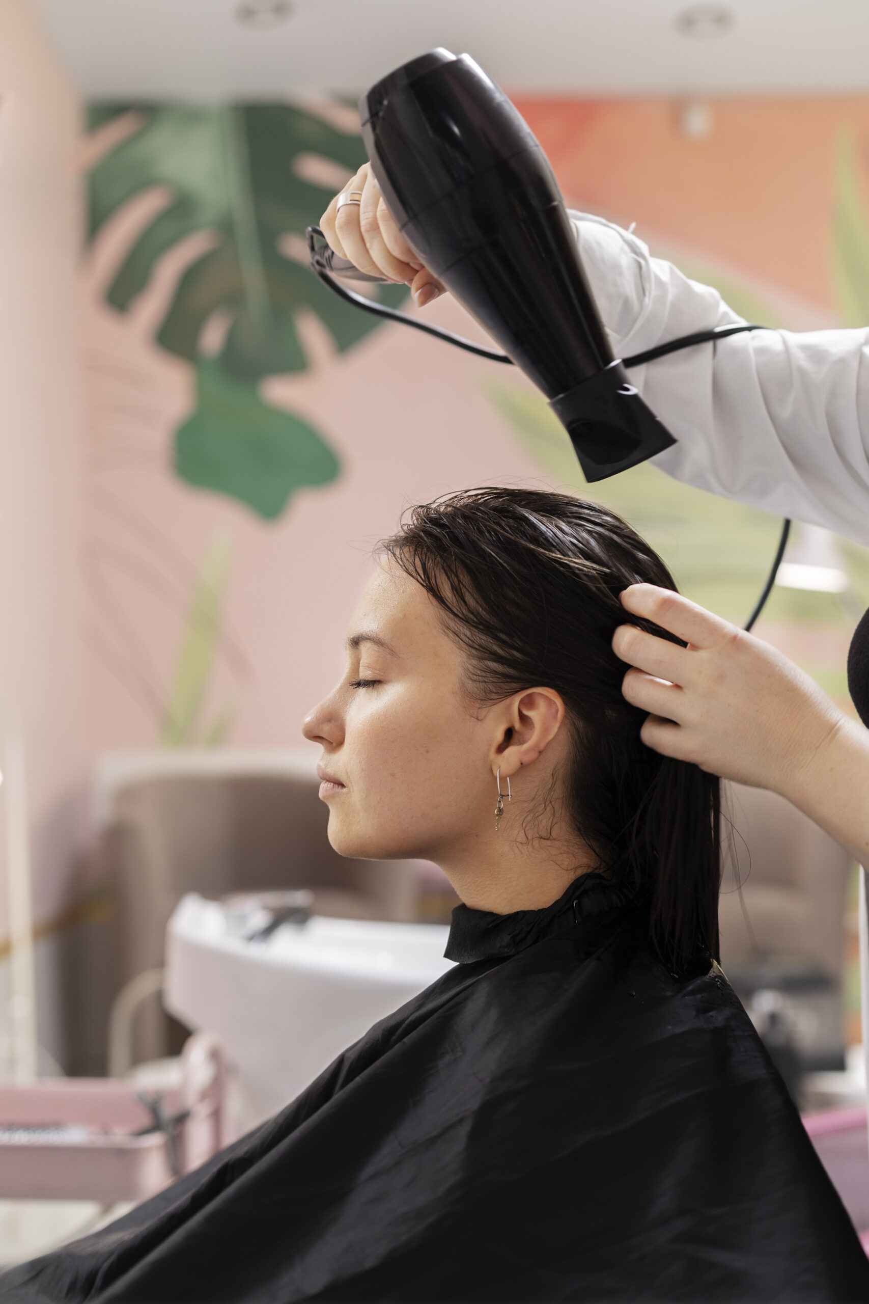 woman getting treatment hairdresser shop